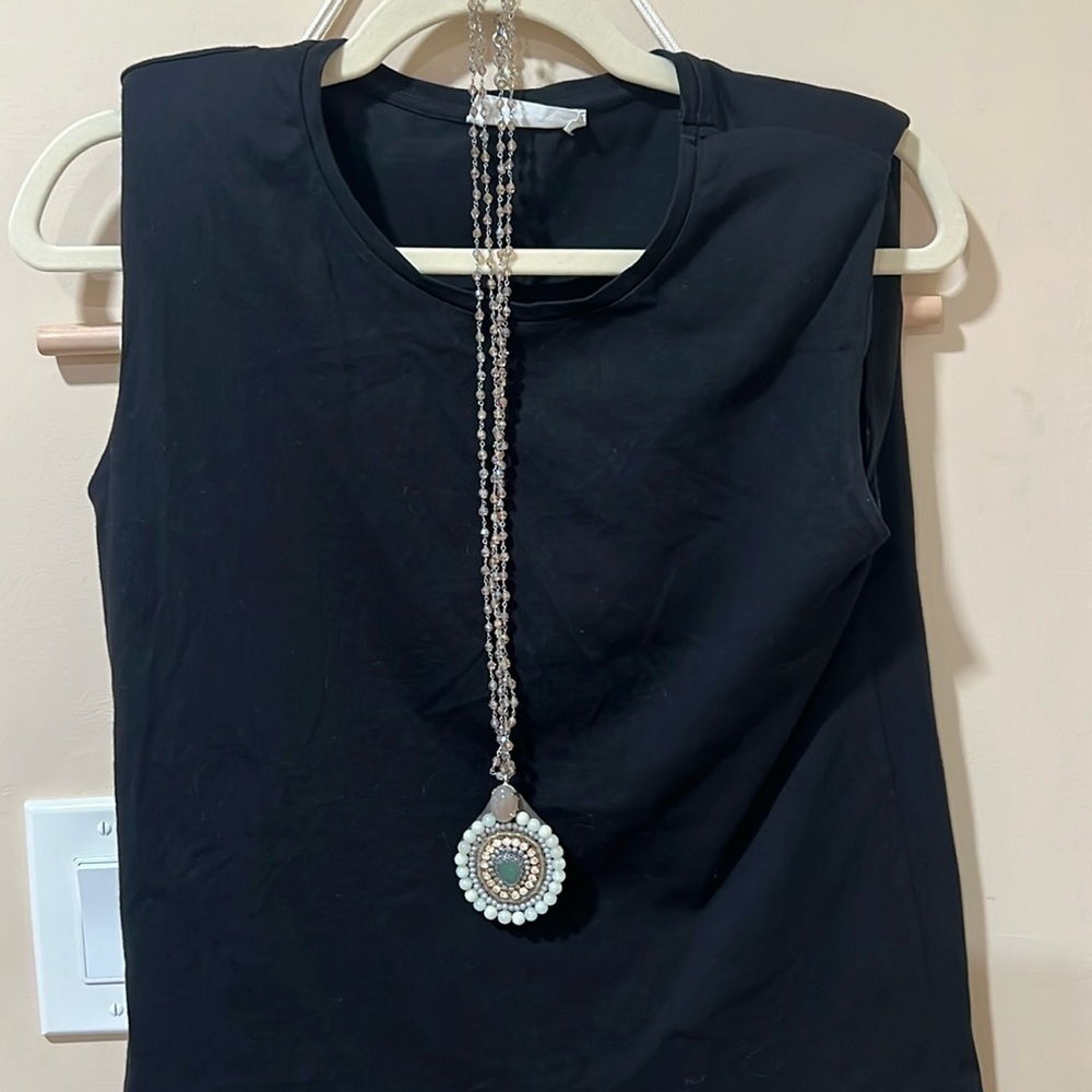 Beaded pendant necklace with double crystal light pink strands.